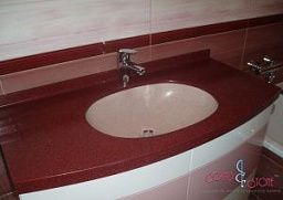 Красная овальная столешница из искусственного камня в ванную комнату